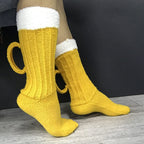 Yellow beer novelty socks, beer mug design with handle, side view