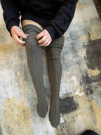 Charcoal cable knit thigh high socks, pulled up over the knee