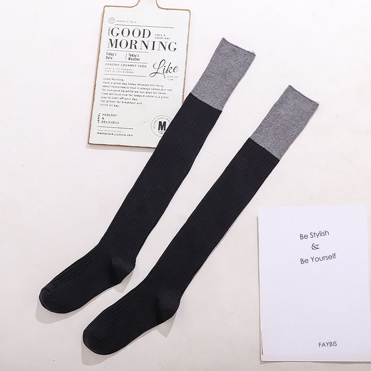 Black cotton over the knee socks with gray trim, flat lay showing the contrast cuff