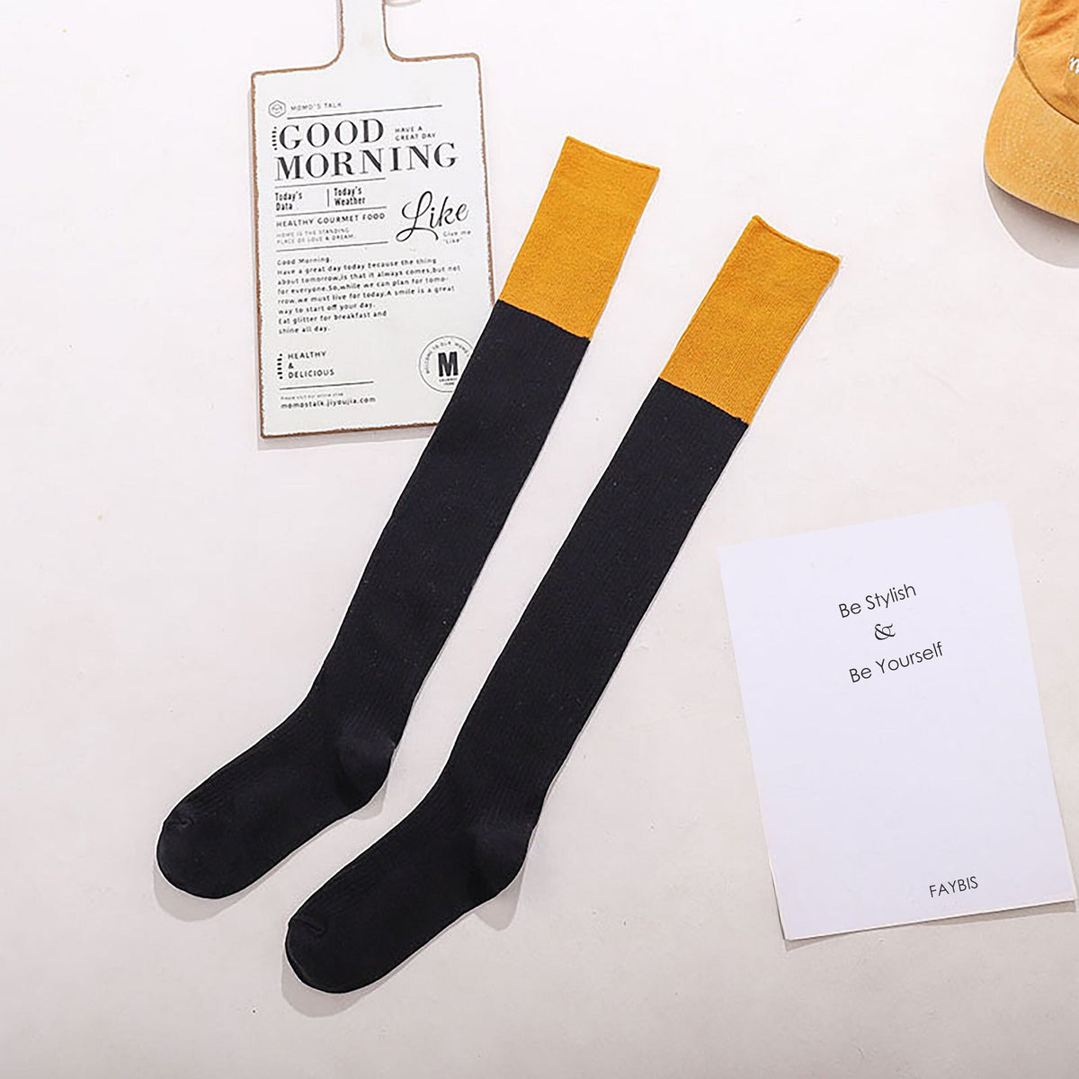 Black cotton over the knee socks with yellow trim, flat lay showing the contrast cuff