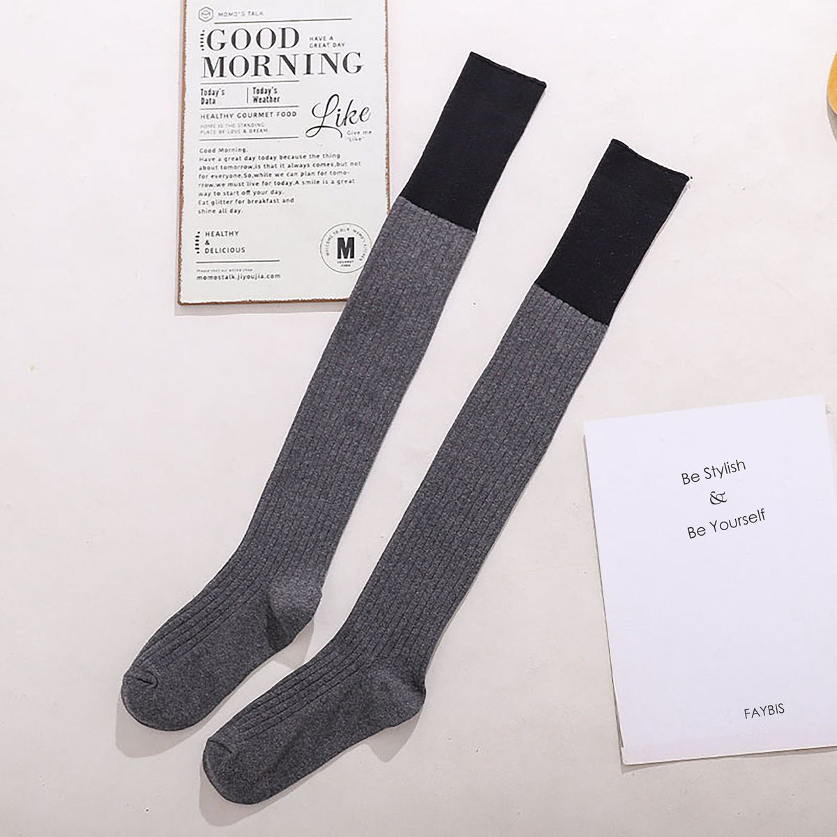 Gray cotton over the knee socks with black trim, flat lay showing the contrast cuff