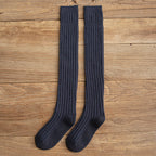 Navy blue cotton thigh high socks, flat lay showing the ribbed knit