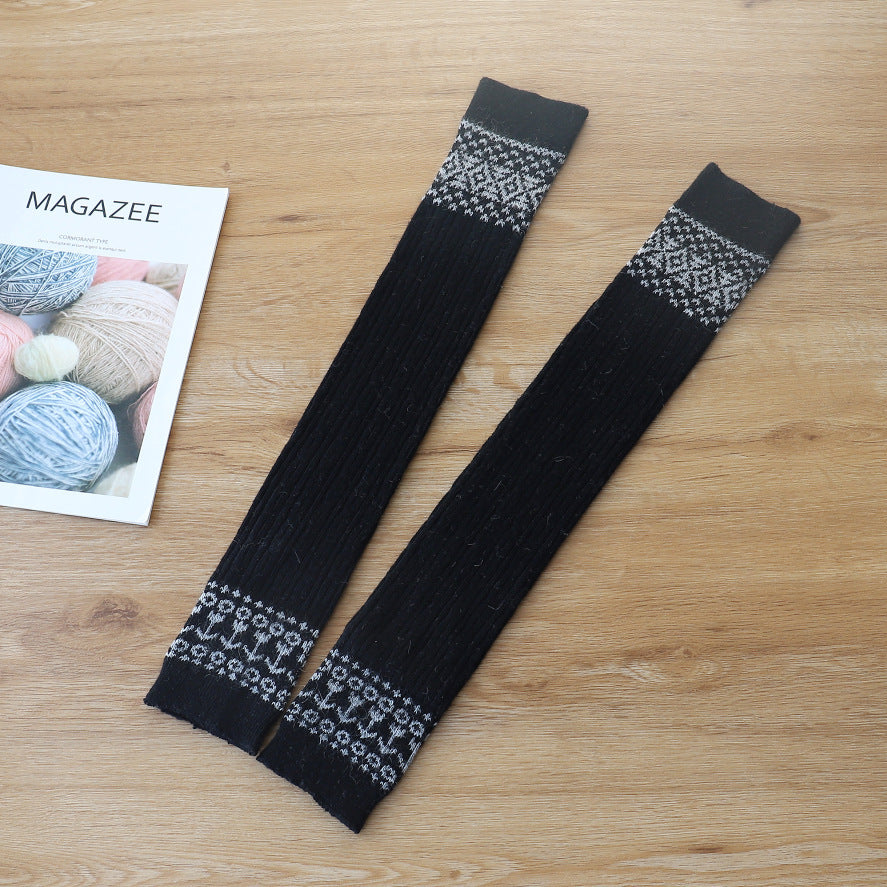 Black diamond cable knit thigh high socks, flat lay showing the diamond pattern