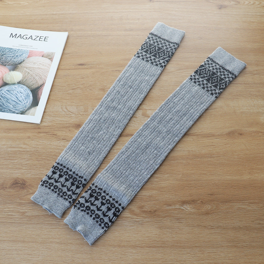 Light gray diamond cable knit thigh high socks, flat lay showing the diamond pattern