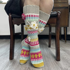 Gray and red floral jacquard knee high socks, worn while seated, 3D flower detail