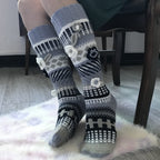 Gray and white floral jacquard knee high socks, worn on a fluffy rug, 3D flower detail