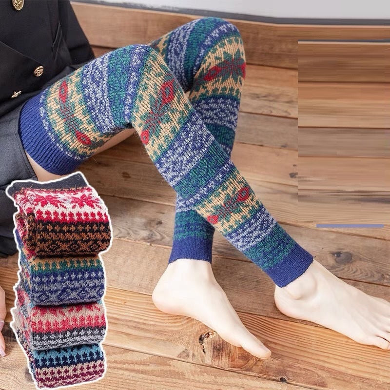 Fair Isle fuzzy thigh high leg warmers, worn barefoot with folded pairs beside
