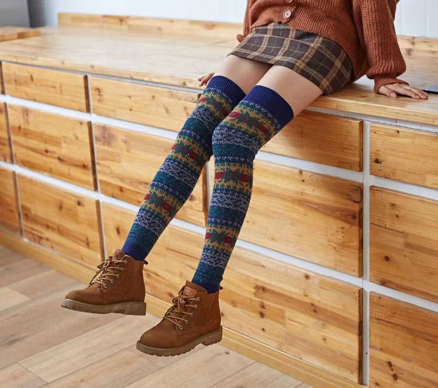 Fair Isle fuzzy thigh high leg warmers, worn with a plaid skirt and ankle boots
