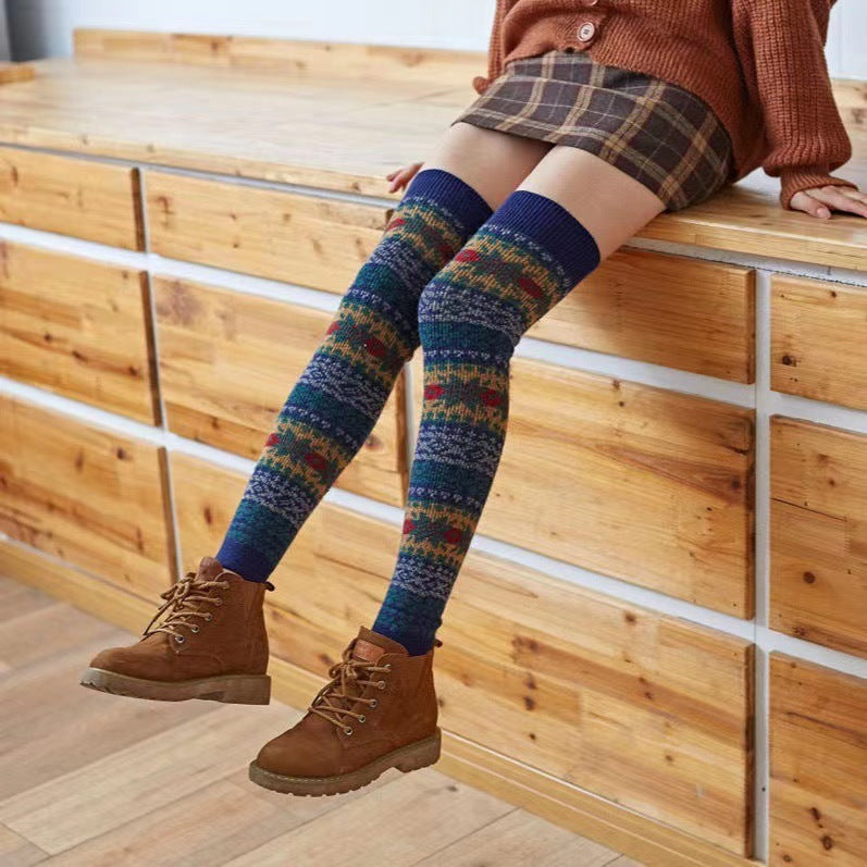 Fair Isle fuzzy thigh high leg warmers, worn with a plaid skirt and ankle boots