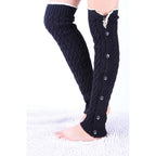 Black lace trim button leg warmers, worn standing, full length