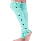 Mint green lace trim button leg warmers, worn standing, button front