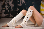 White lace trim button leg warmers, worn sitting, button and lace trim detail