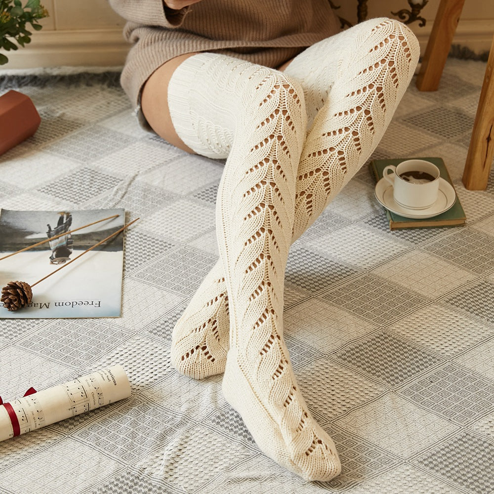 Cream mesh knit over the knee socks, lounging on a rug, close-up of the mesh knit