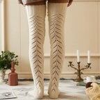 Cream mesh knit over the knee socks, worn standing in a cozy room