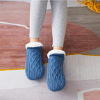 Blue non-slip slipper socks, worn, sherpa-lined cuff