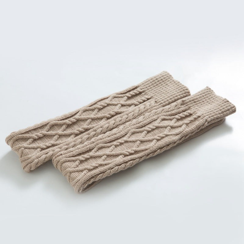 Beige over the knee leg warmers, flat lay of the cable knit pair