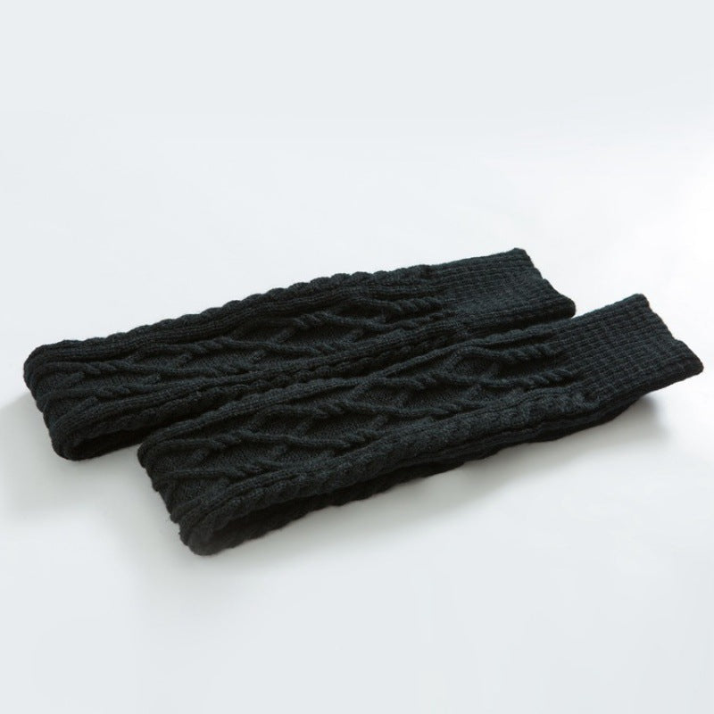Black over the knee leg warmers, flat lay of the cable knit pair