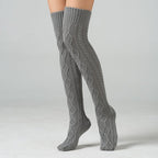 Light gray over the knee leg warmers, worn standing, front view