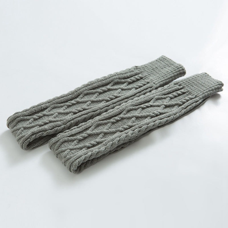 Light gray over the knee leg warmers, flat lay of the cable knit pair