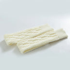 White over the knee leg warmers, flat lay of the cable knit pair