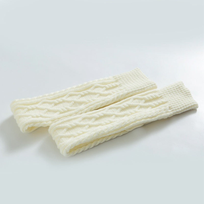 White over the knee leg warmers, flat lay of the cable knit pair