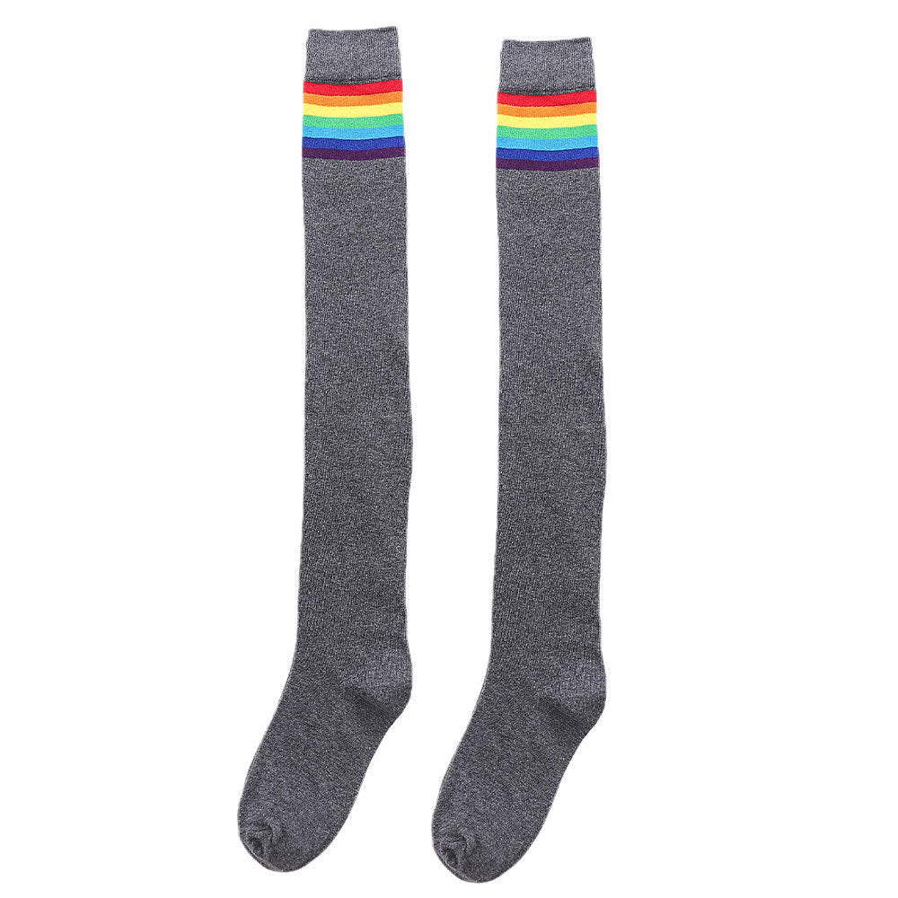 Gray rainbow stripe thigh high socks, flat lay with rainbow stripe top