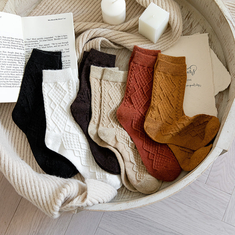 Ribbed wool blend crew socks in assorted colours, pairs in a woven basket