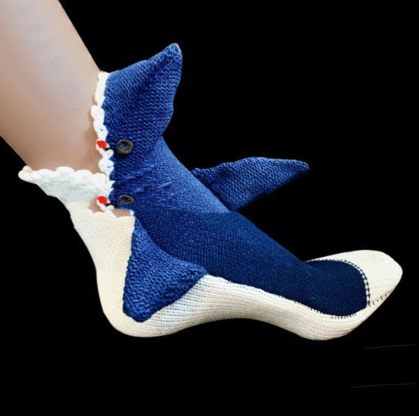 Blue shark slipper socks, shark design on a black background