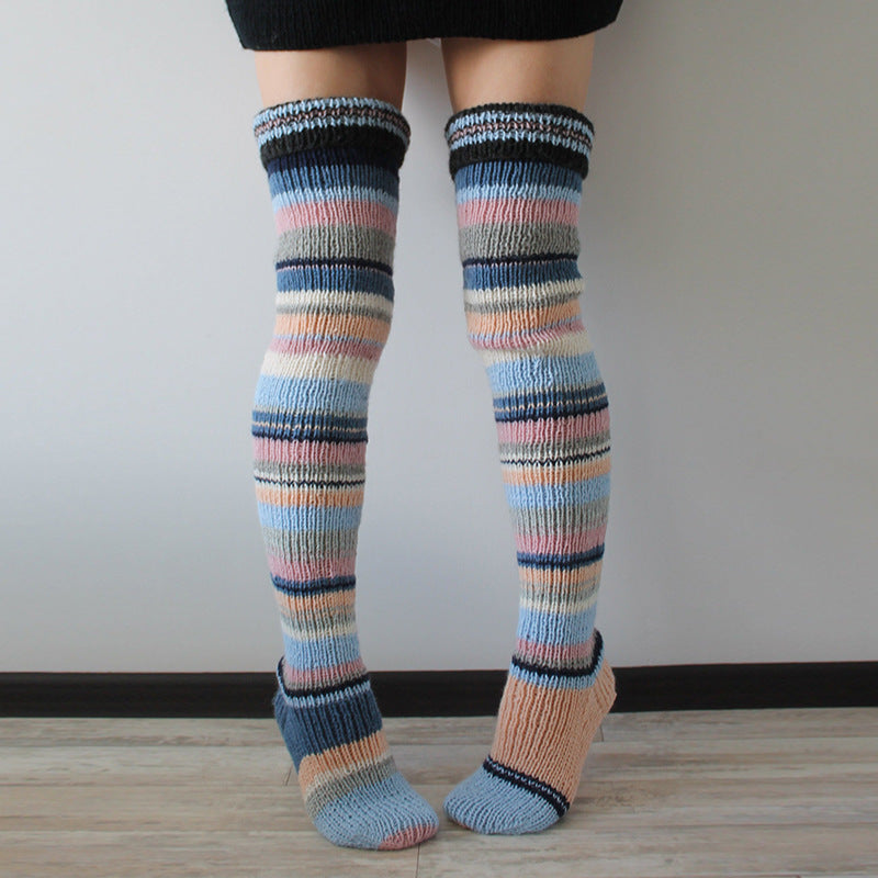 Pastel blue and pink striped thigh high socks, front view of the knitted stripes