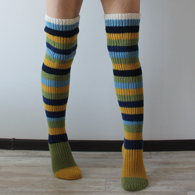 Yellow and blue striped thigh high socks, front view of the knitted stripes
