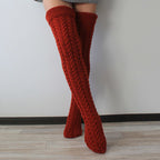 Deep red thick cable knit over the knee socks, side view of the chunky cable knit