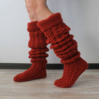 Deep red thick cable knit over the knee socks, slouched down at the ankle
