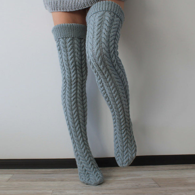 Gray thick cable knit over the knee socks, side view of the chunky cable knit