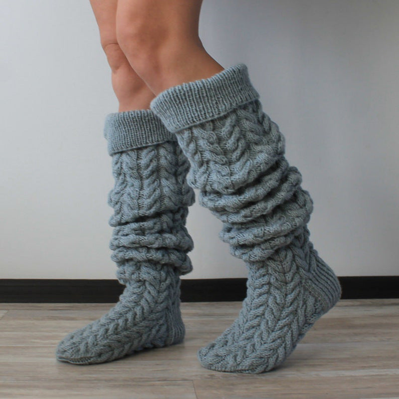 Gray thick cable knit over the knee socks, slouched down at the ankle