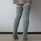 Gray thick cable knit over the knee socks, back view of the chunky cable knit
