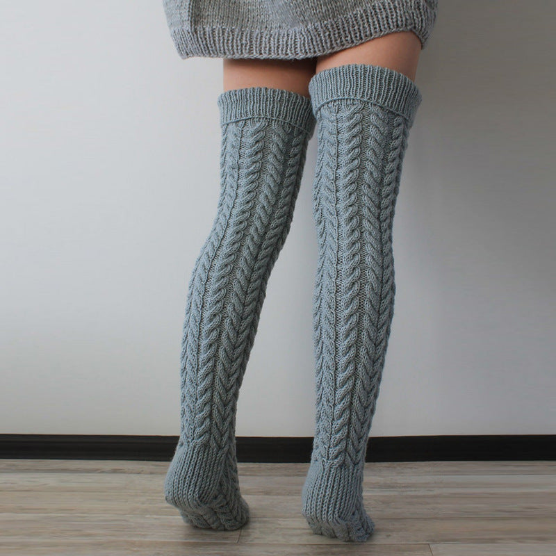Gray thick cable knit over the knee socks, back view of the chunky cable knit