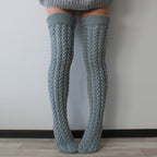Gray thick cable knit over the knee socks, back view of the chunky cable knit