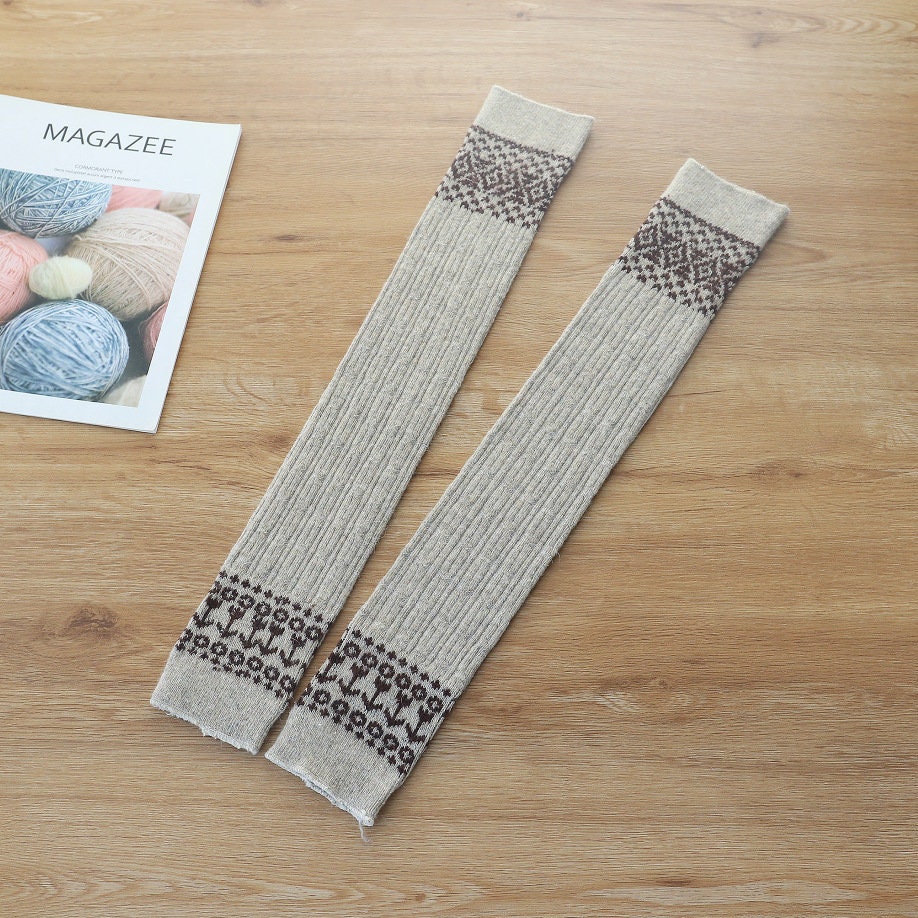Apricot wool blend thigh high socks, flat lay showing the Fair Isle band